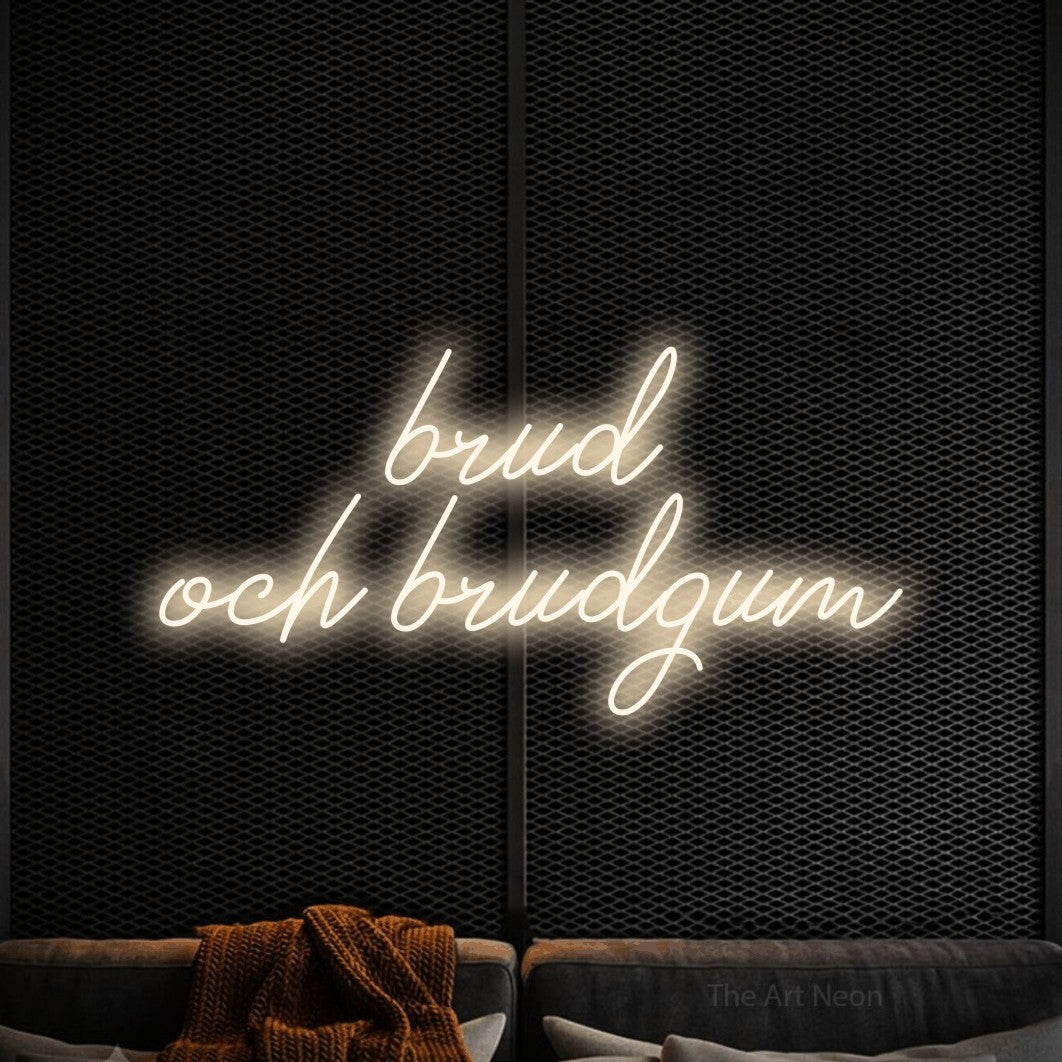 LED neon sign reading “brud och brudgum”, arranged in 2 lines.