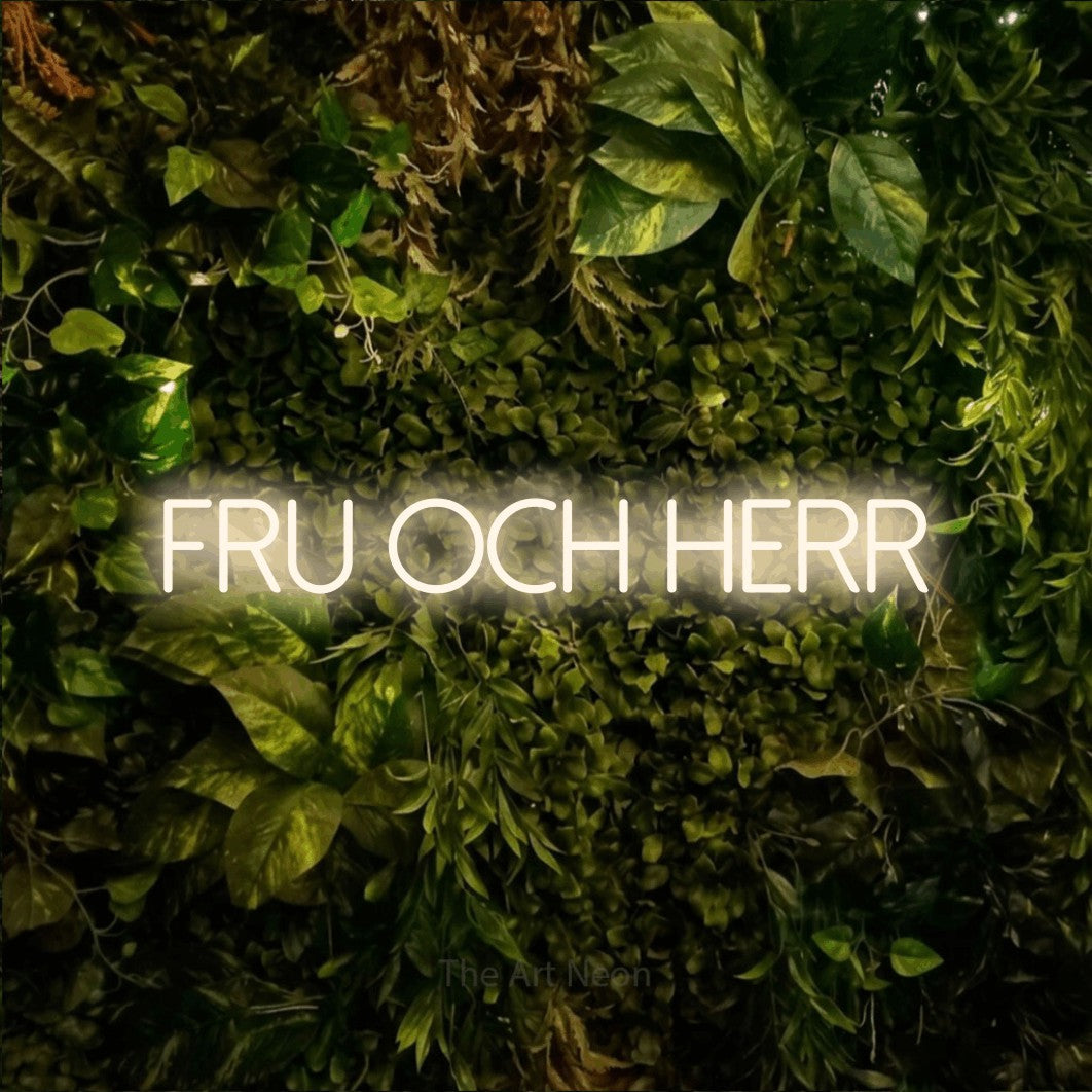 LED neon sign reading “FRU OCH HERR”, arranged in a single line.