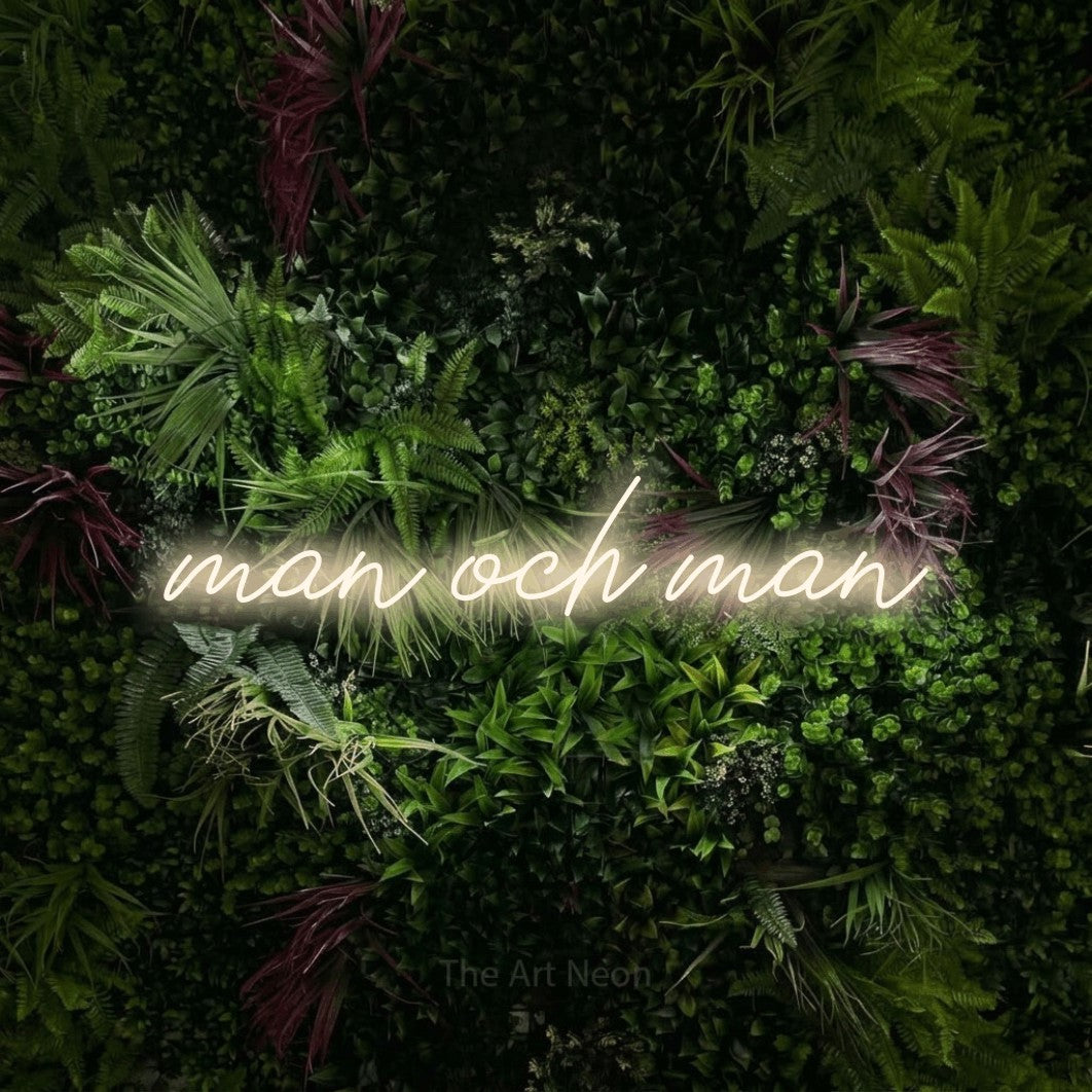 LED neon sign reading “man och man”, arranged in a single line.