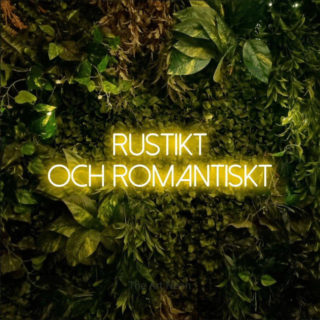 LED neon sign reading “Rustikt och romantiskt”, arranged in 2 lines.