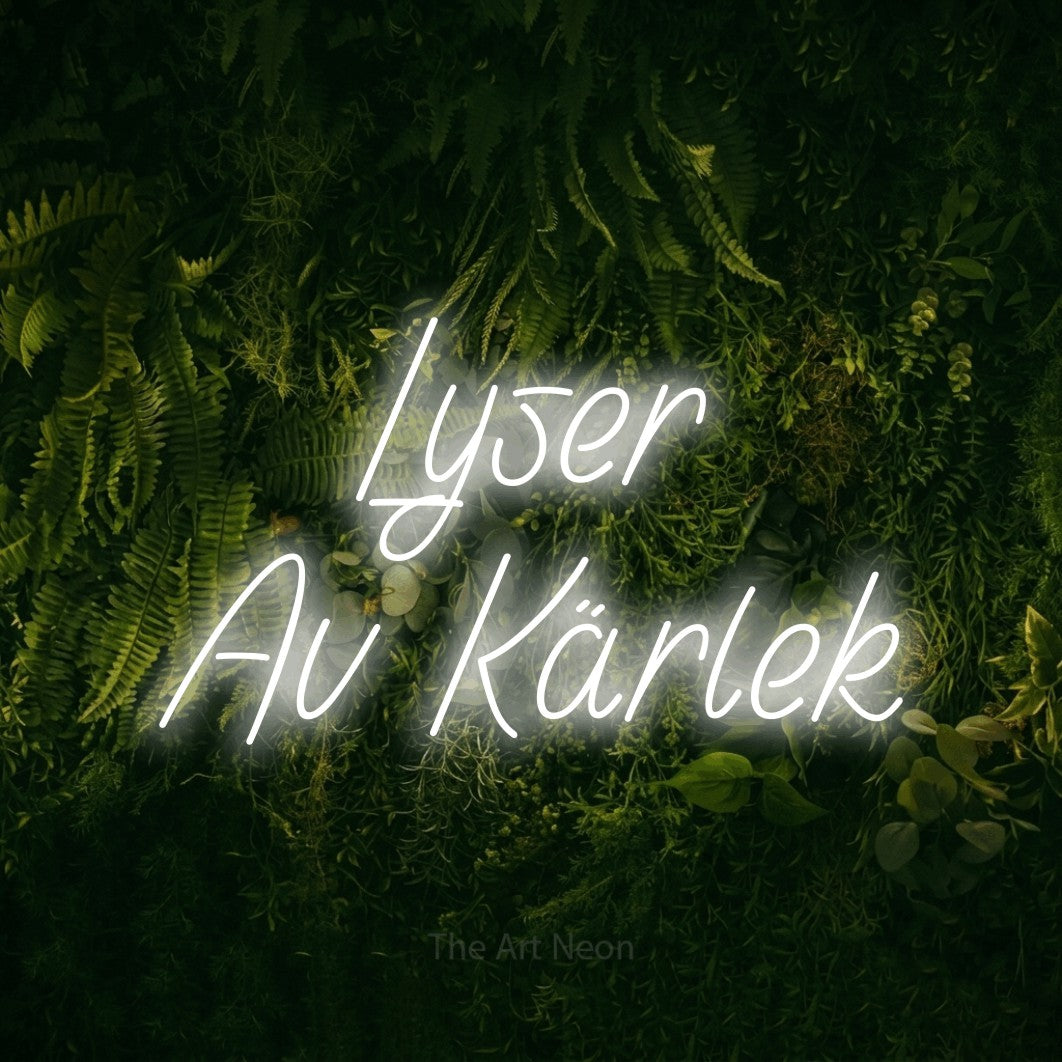 LED neon sign reading “Lyser Av Kärlek”, arranged in 2 lines.