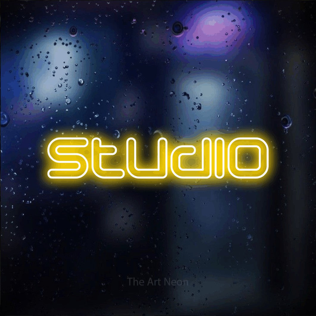LED neon sign reading “Studio”, arranged in a single line.