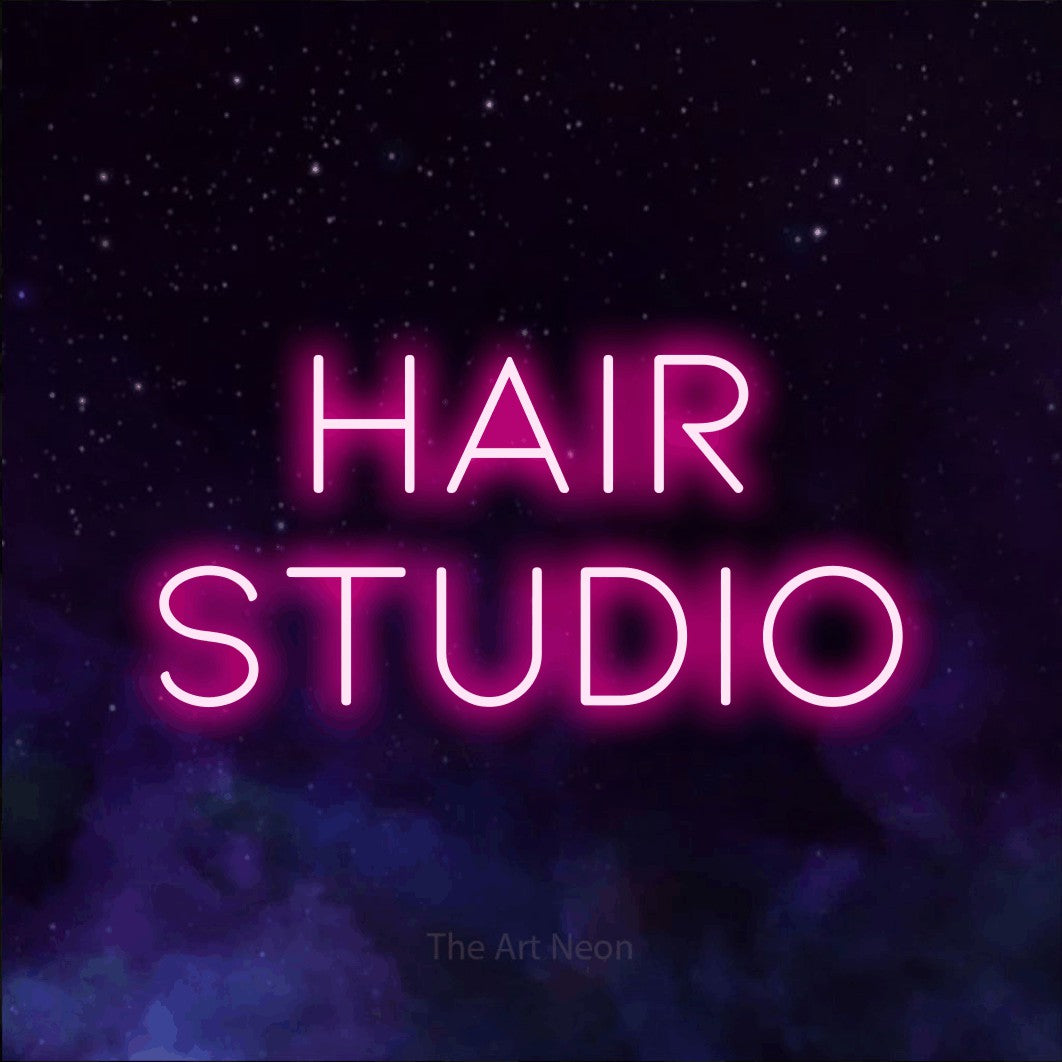 LED neon sign reading “Hair Studio”, arranged in 2 lines.
