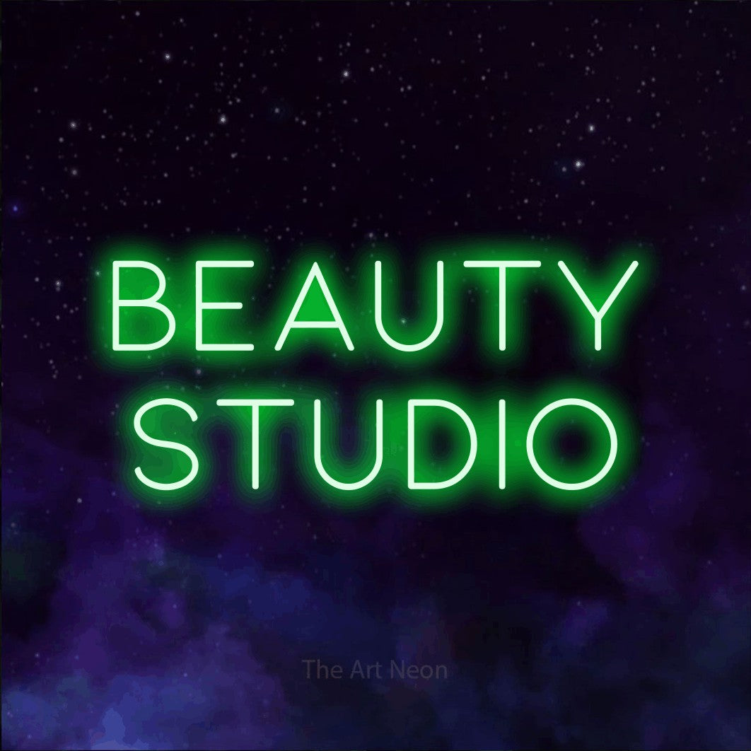LED neon sign reading “beauty studio”, arranged in 2 lines.