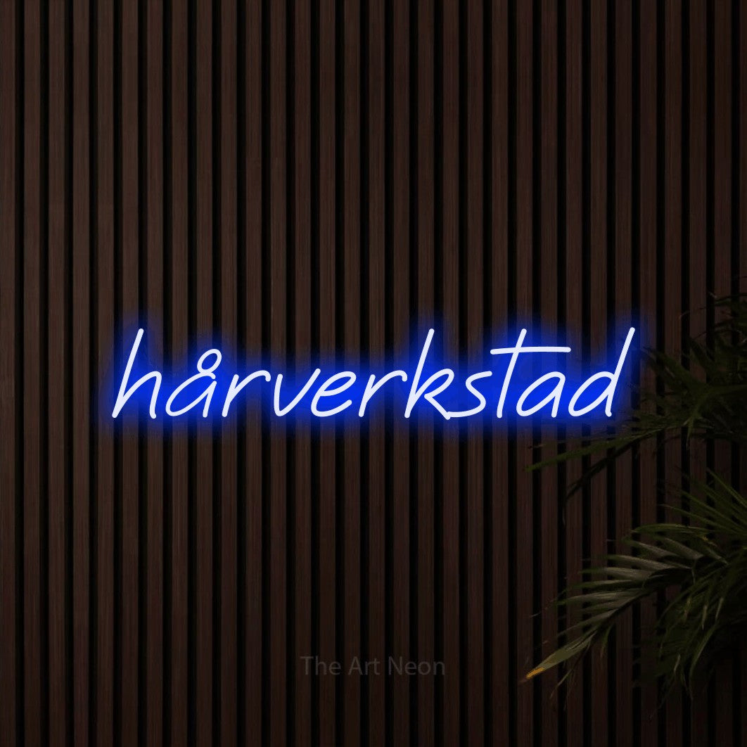 LED neon sign reading “hårverkstad”, arranged in a single line.