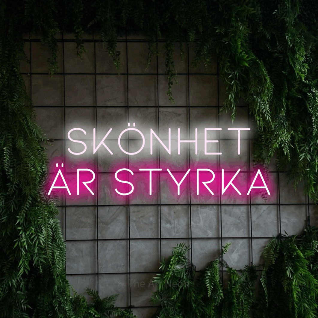 LED neon sign reading “SKÖNHET ÄR STYRKA”, arranged in 2 lines.