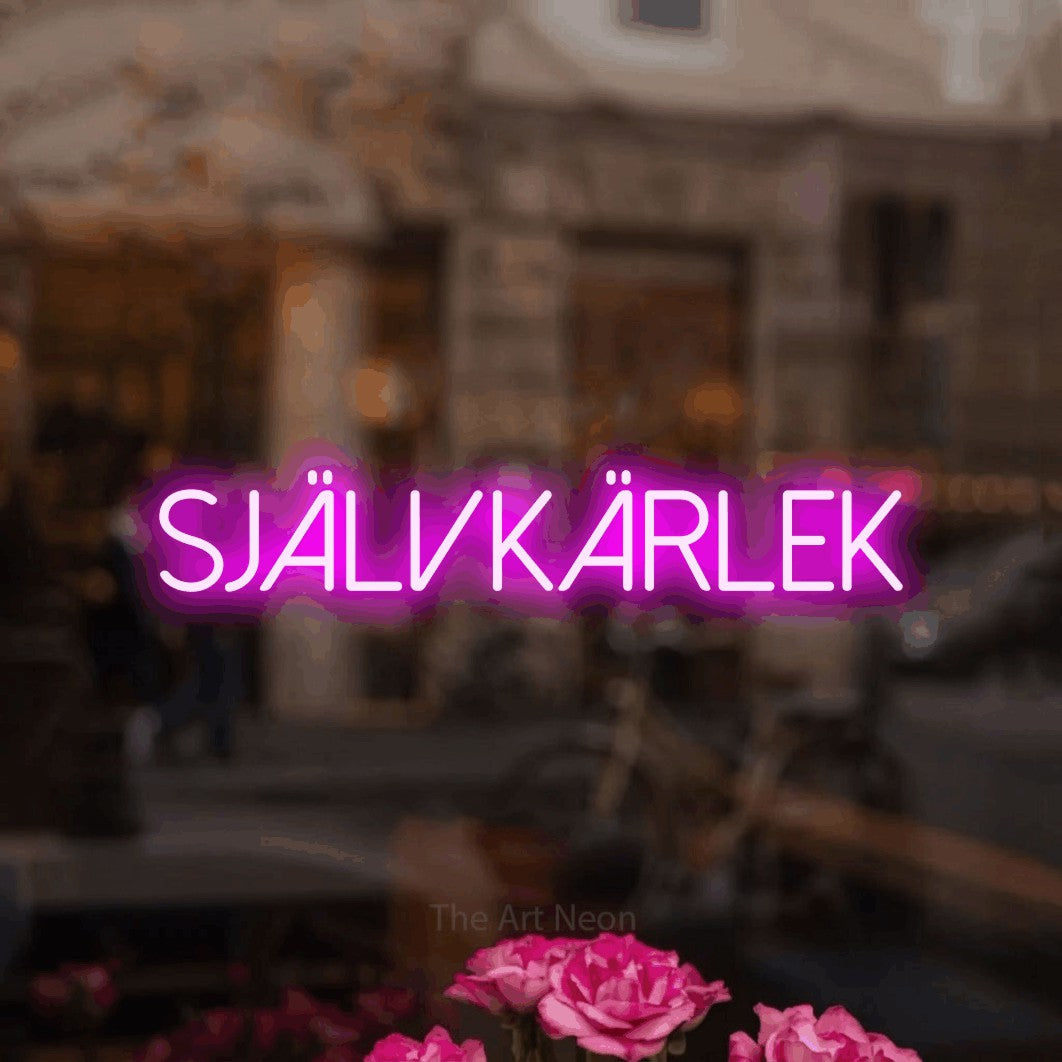 LED neon sign reading “SJÄLVKÄRLEK”, arranged in a single line.