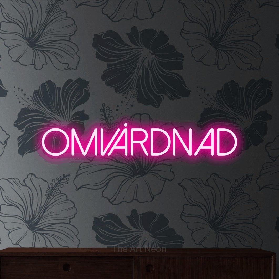 LED neon sign reading “OMVÅRDNAD”, arranged in a single line.