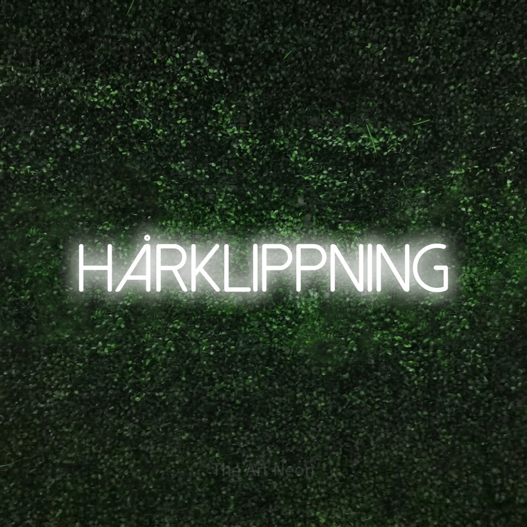 LED neon sign reading “HÅRKLIPPNING”, arranged in a single line.
