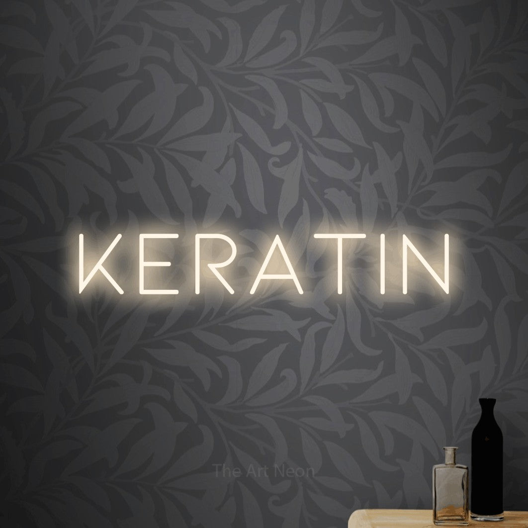 LED neon sign reading “Keratin”, arranged in a single line.