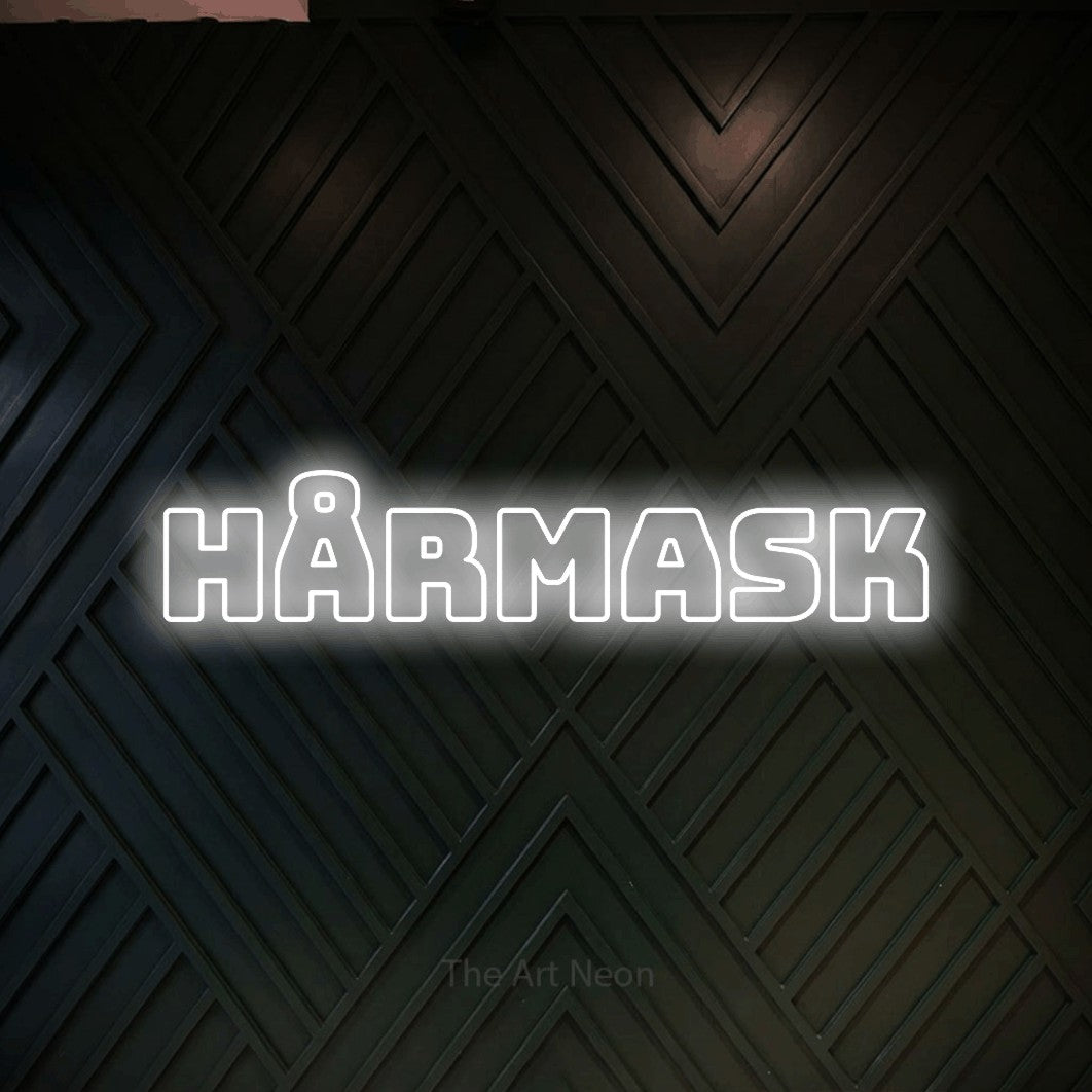 LED neon sign reading “hårmask”, arranged in a single line.