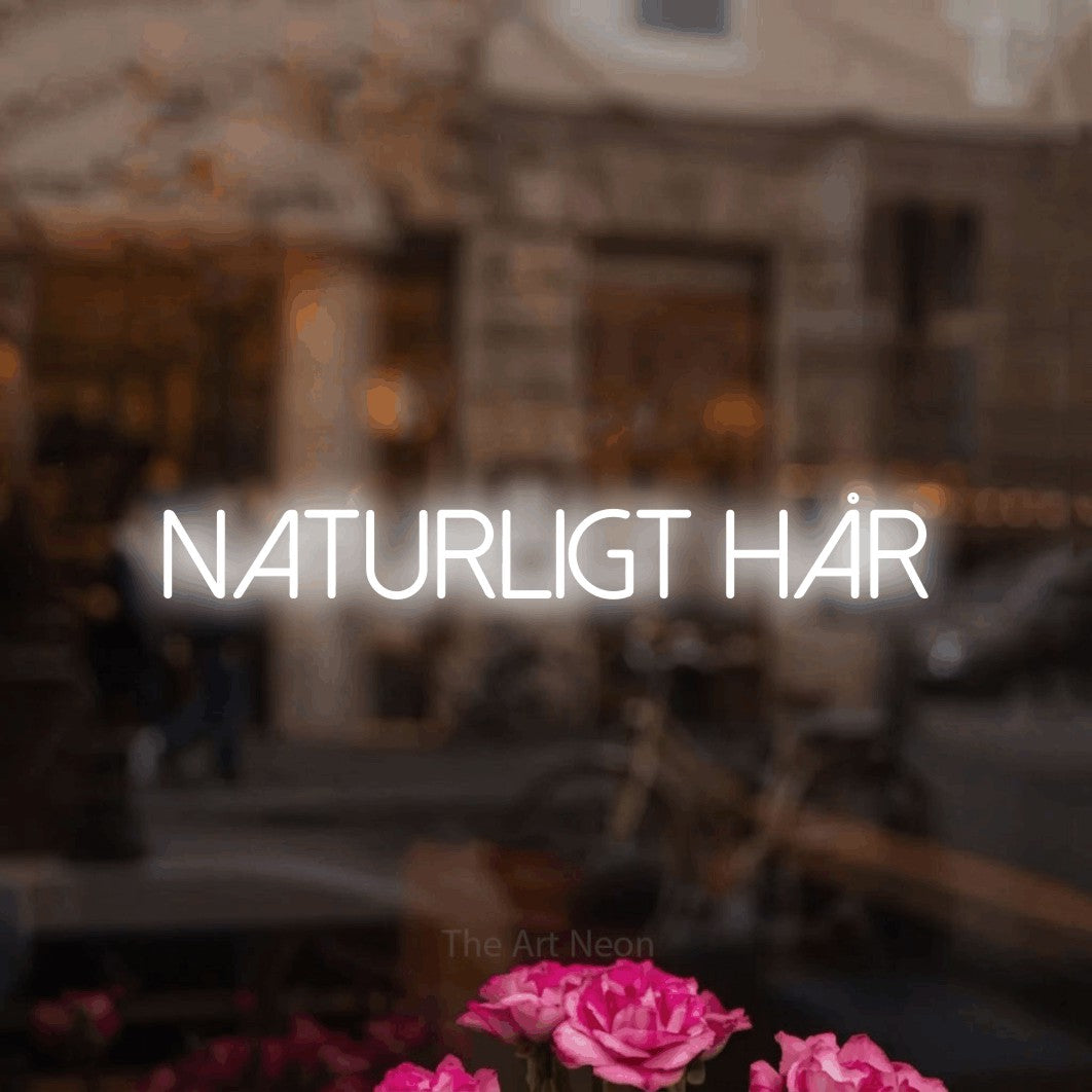 LED neon sign reading “naturligt hår”, arranged in a single line.
