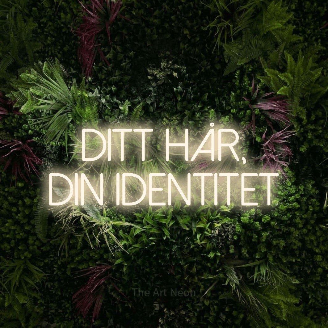LED neon sign reading “Ditt Hår, Din Identitet”, arranged in 2 lines.