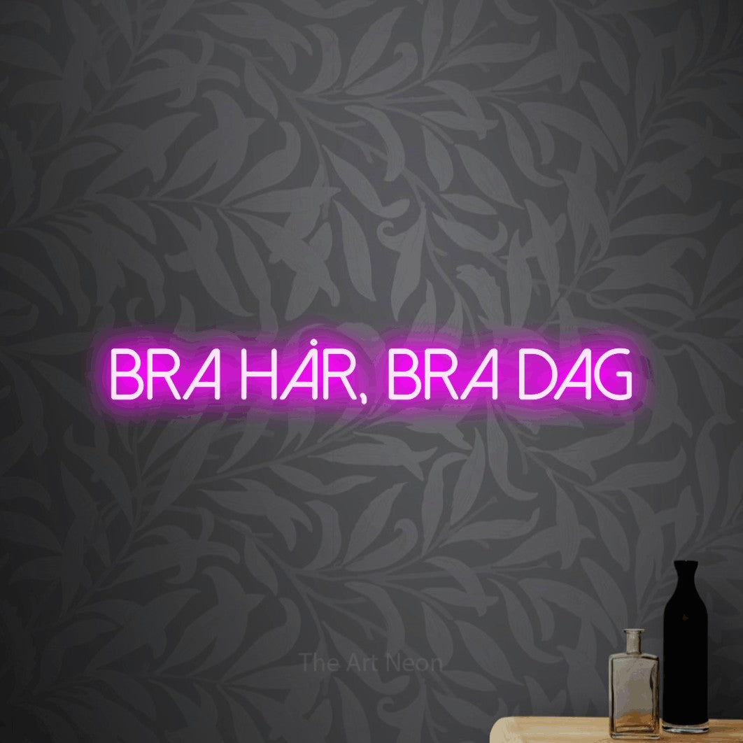 LED neon sign reading “bra hår, bra dag”, arranged in a single line.