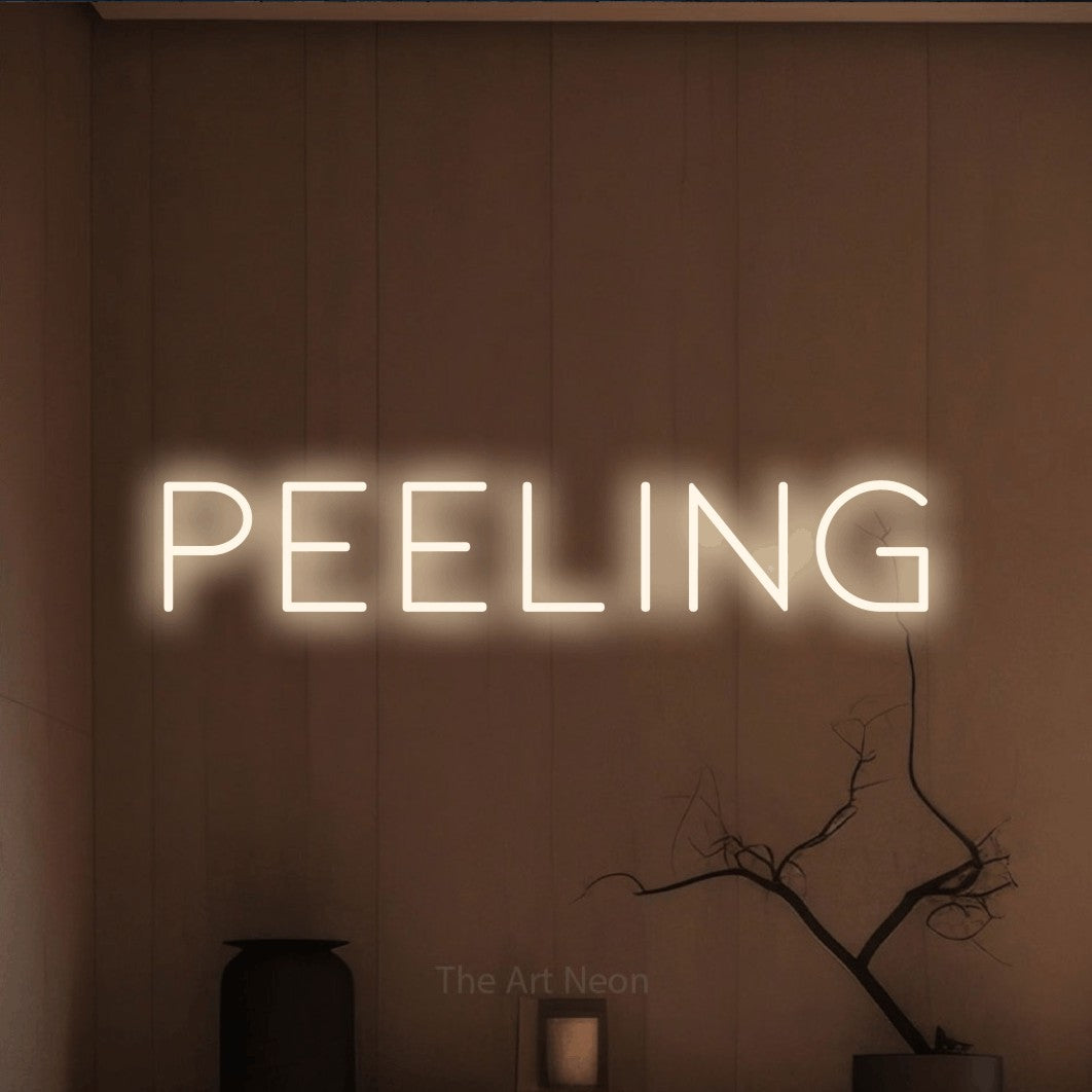 LED neon sign reading “peeling”, arranged in a single line.