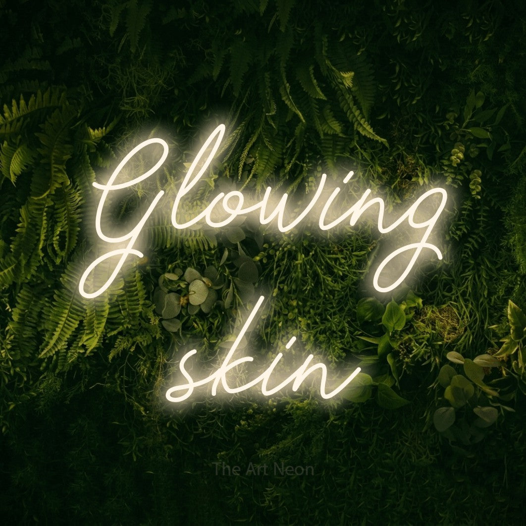 LED neon sign reading “Glowing skin”, arranged in 2 lines.