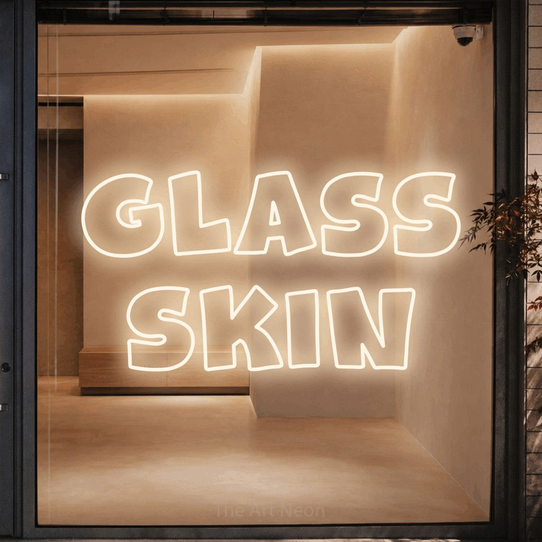 LED neon sign reading “glass skin”, arranged in 2 lines.