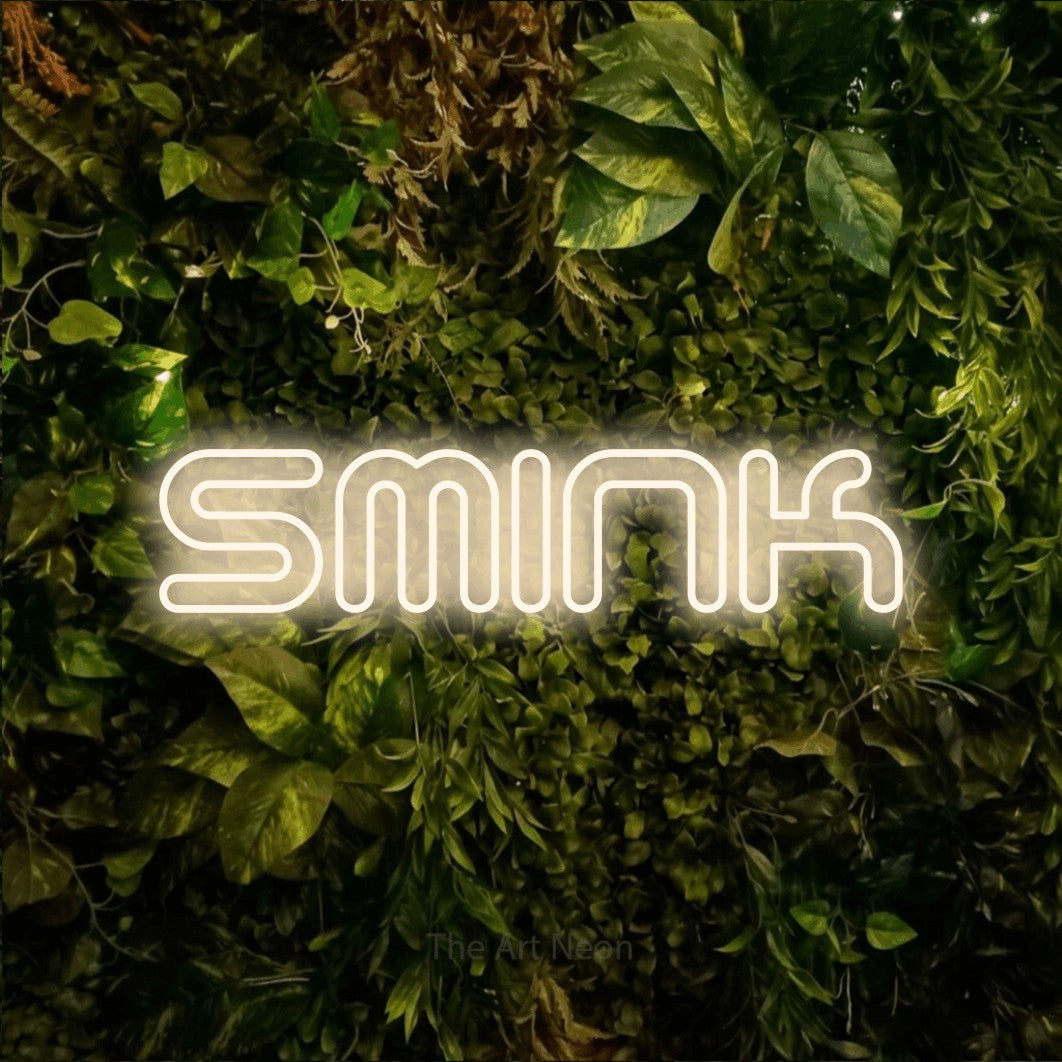 LED neon sign reading “Smink”, arranged in a single line.