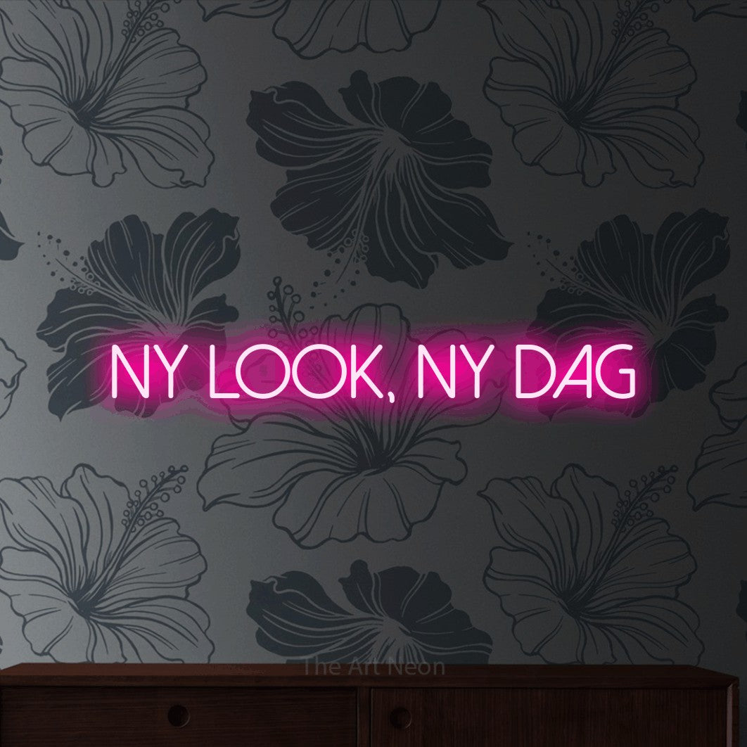 LED neon sign reading “ny look, ny dag”, arranged in a single line.