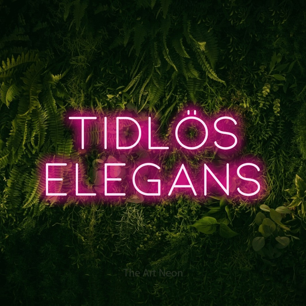 LED neon sign reading “TIDLÖS ELEGANS”, arranged in 2 lines.