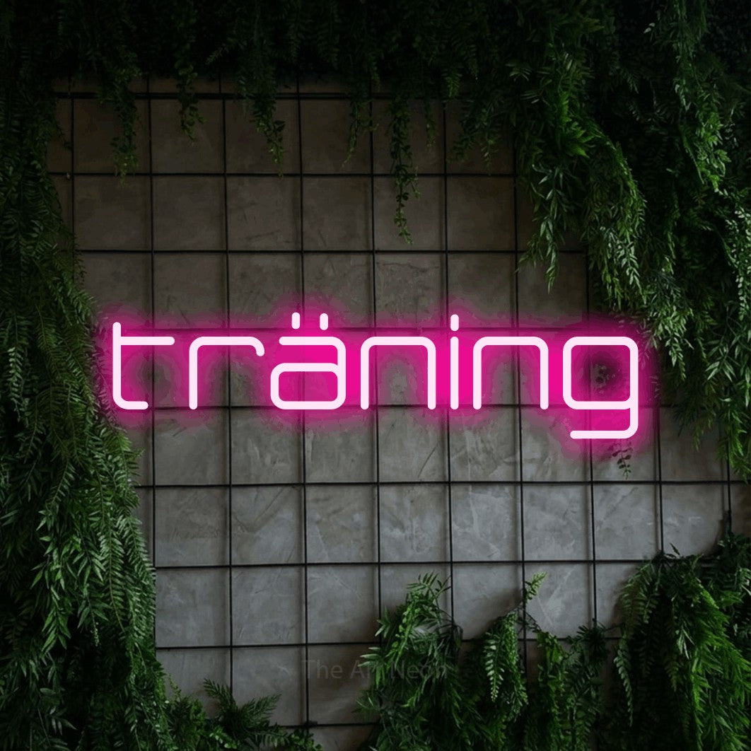 LED neon sign reading “träning”, arranged in a single line.