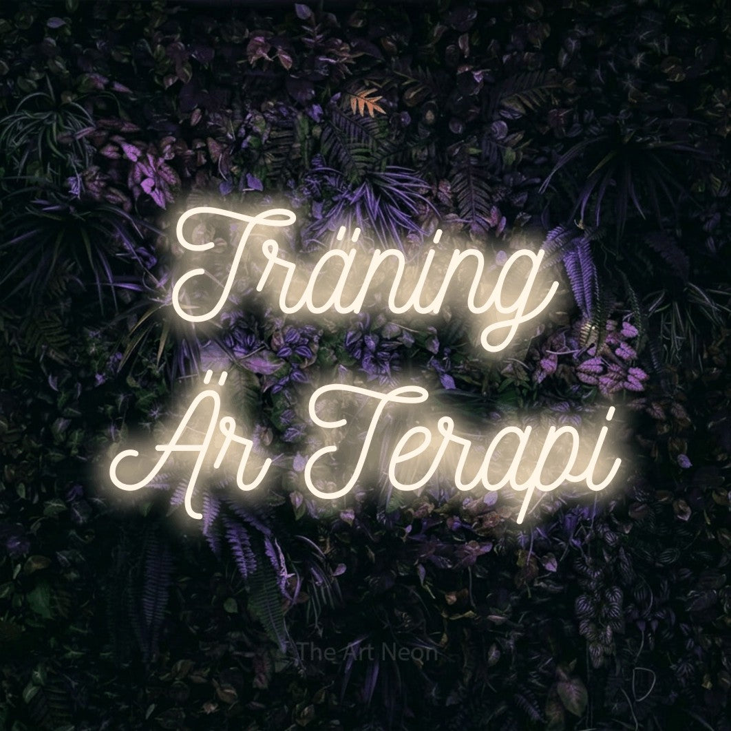 LED neon sign reading “Träning Är Terapi”, arranged in 2 lines.