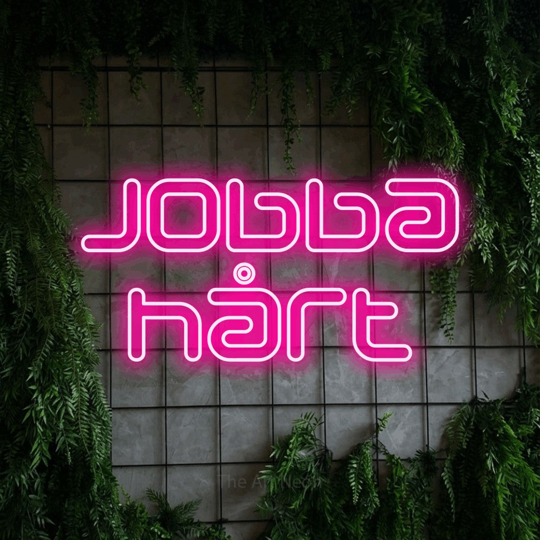 LED neon sign reading “jobba hårt”, arranged in 2 lines.