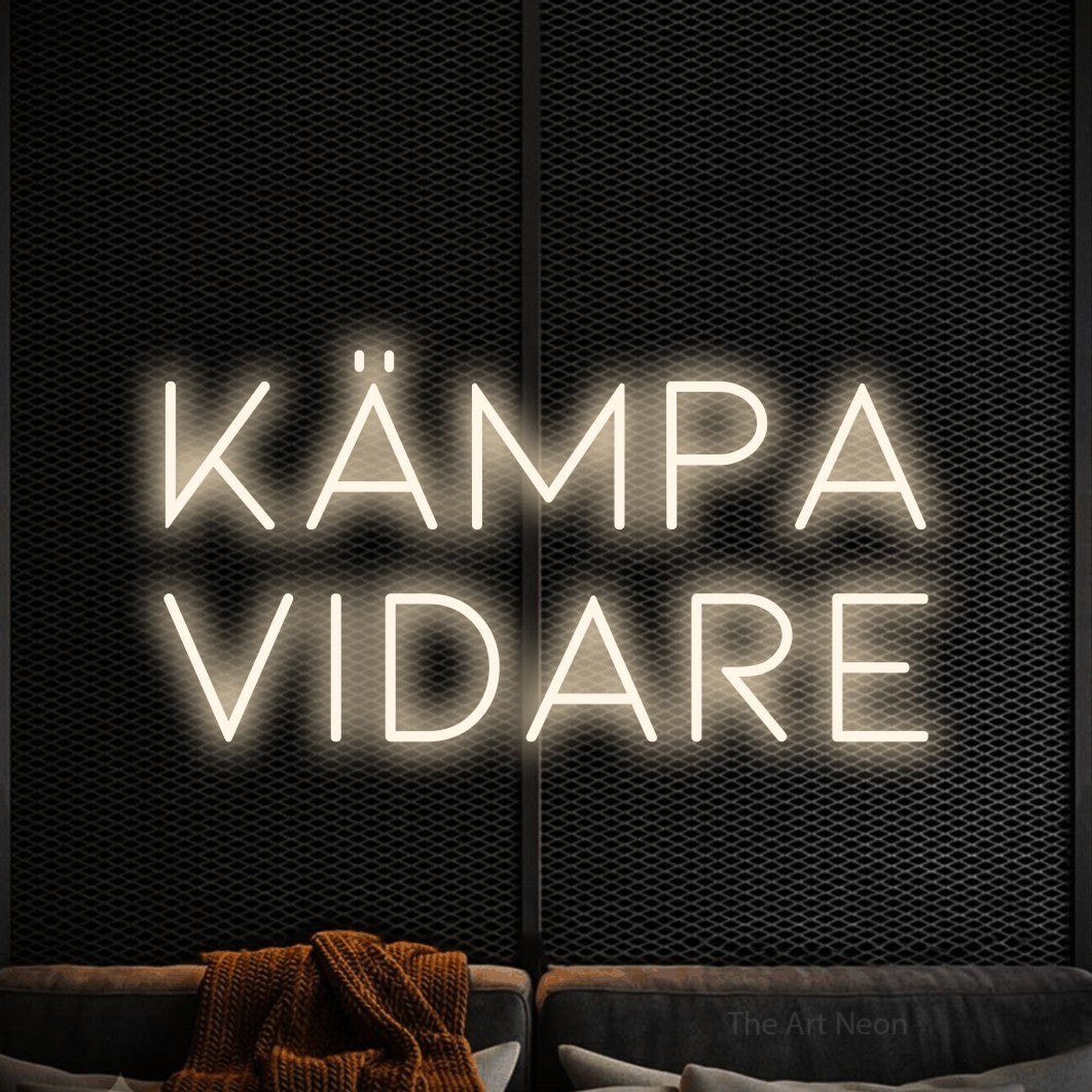 LED neon sign reading “Kämpa Vidare”, arranged in 2 lines.