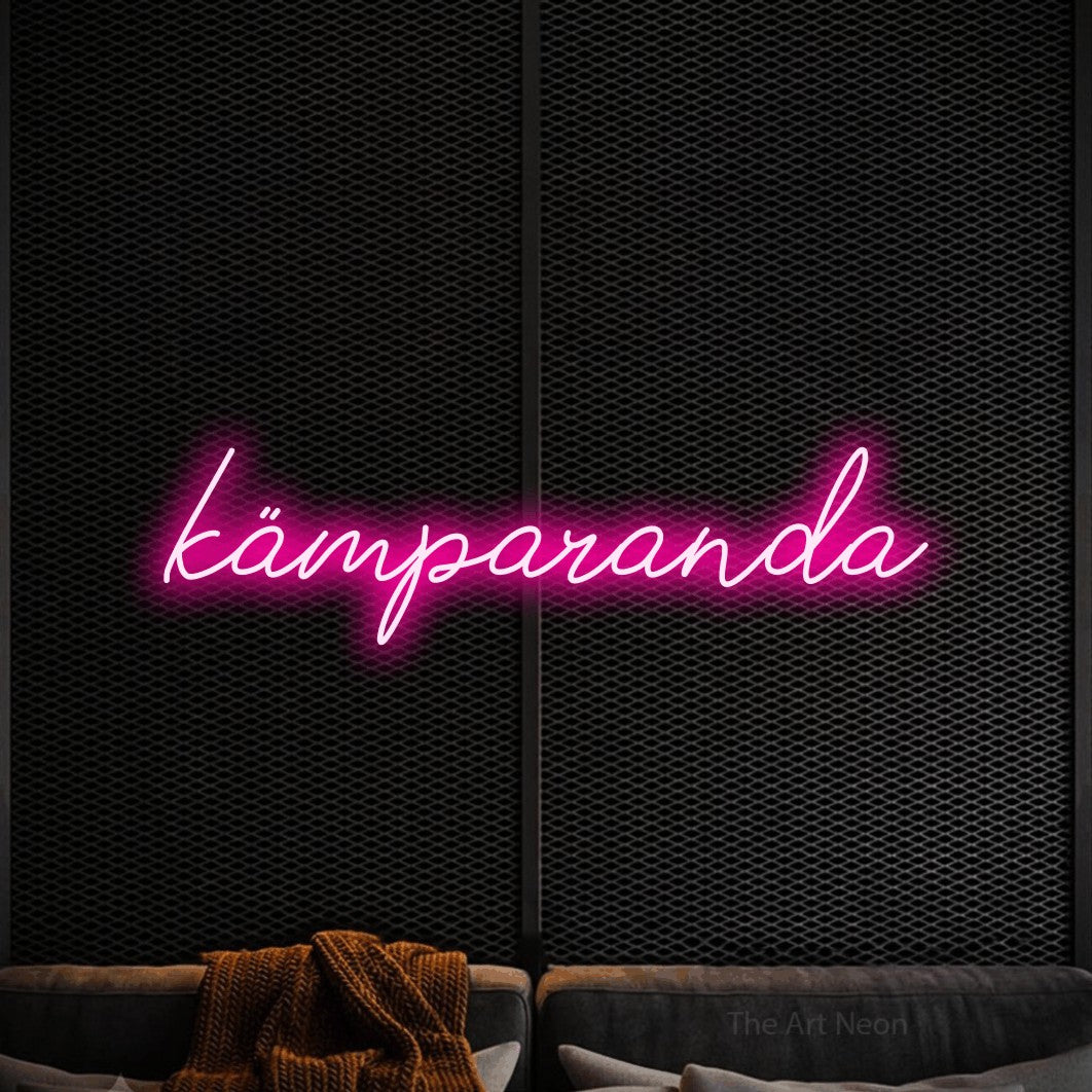 LED neon sign reading “kämparanda”, arranged in a single line.