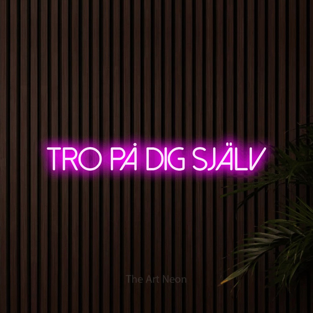 LED neon sign reading “tro på dig själv”, arranged in a single line.
