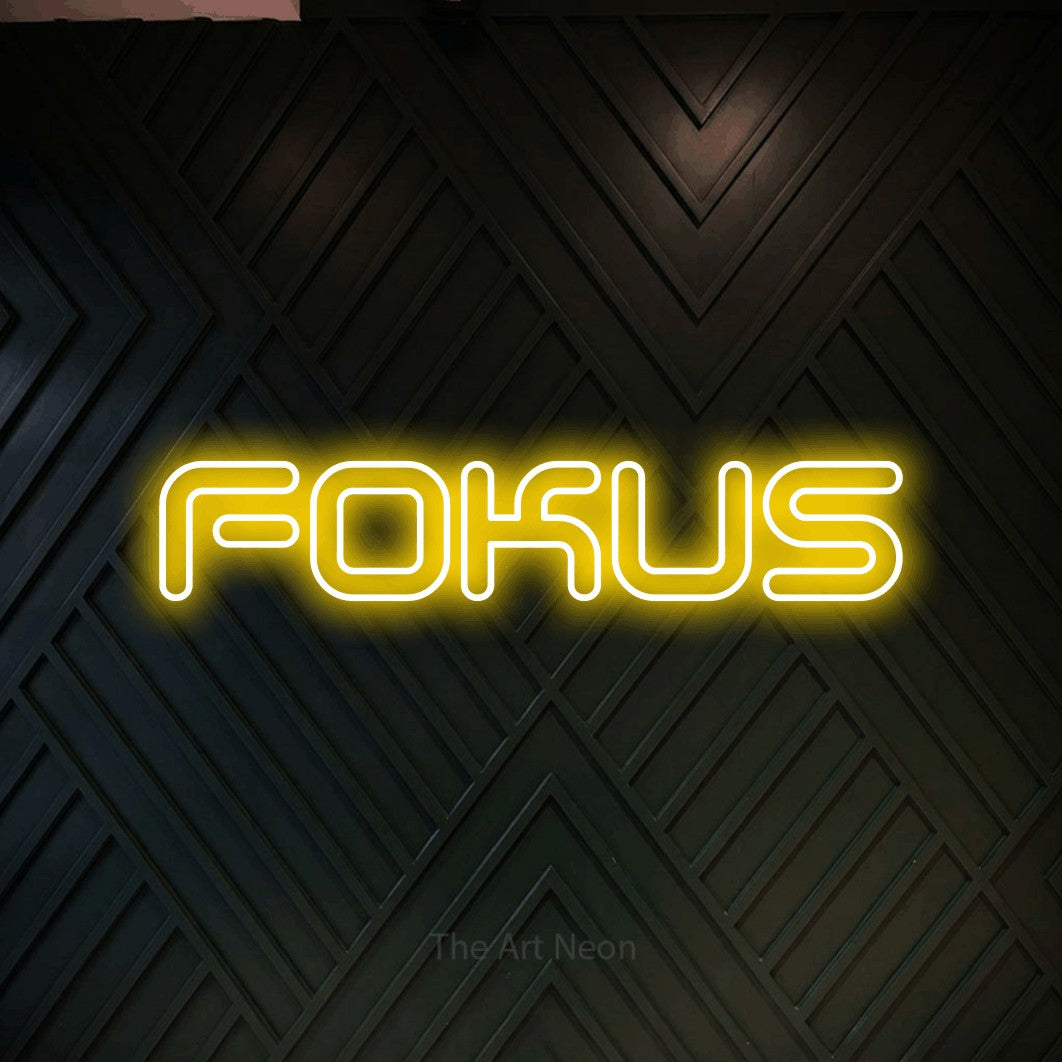LED neon sign reading “FOKUS”, arranged in a single line.