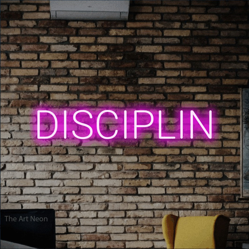 LED neon sign reading “DISCIPLIN”, arranged in a single line.