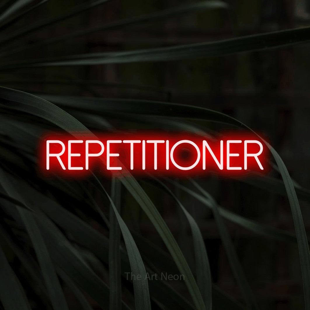 LED neon sign reading “REPETITIONER”, arranged in a single line.