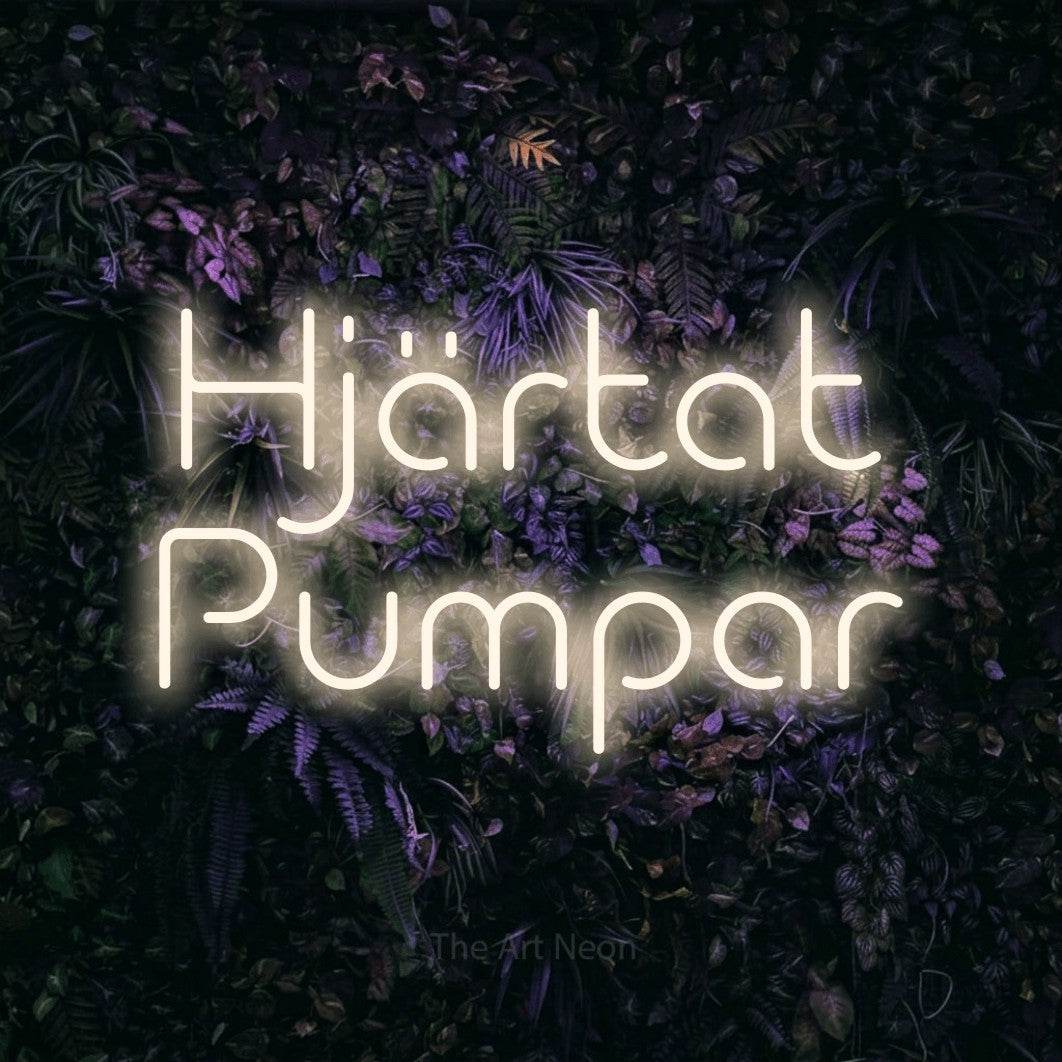 LED neon sign reading “Hjärtat Pumpar”, arranged in 2 lines.