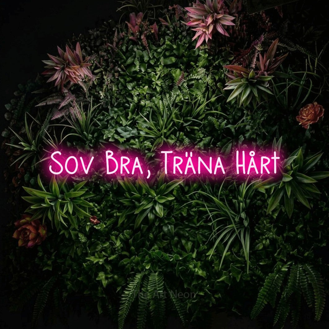 LED neon sign reading “Sov Bra, Träna Hårt”, arranged in a single line.