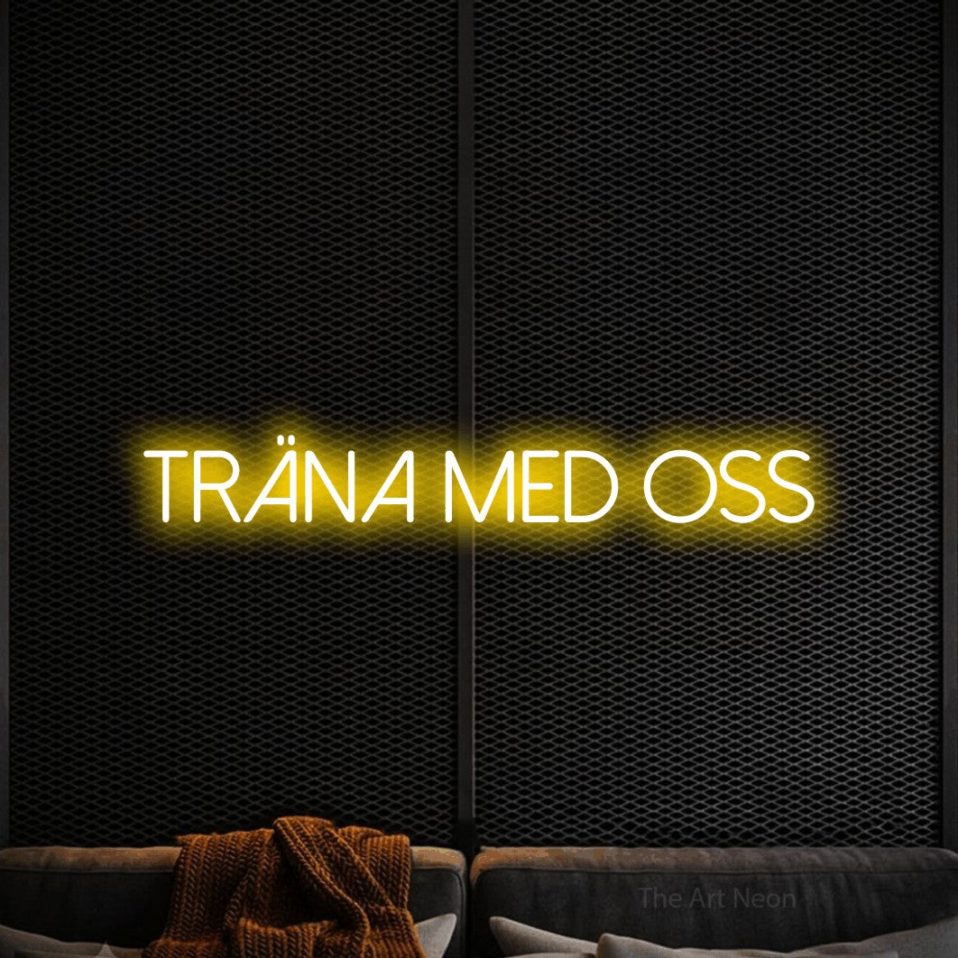 LED neon sign reading “träna med oss”, arranged in a single line.