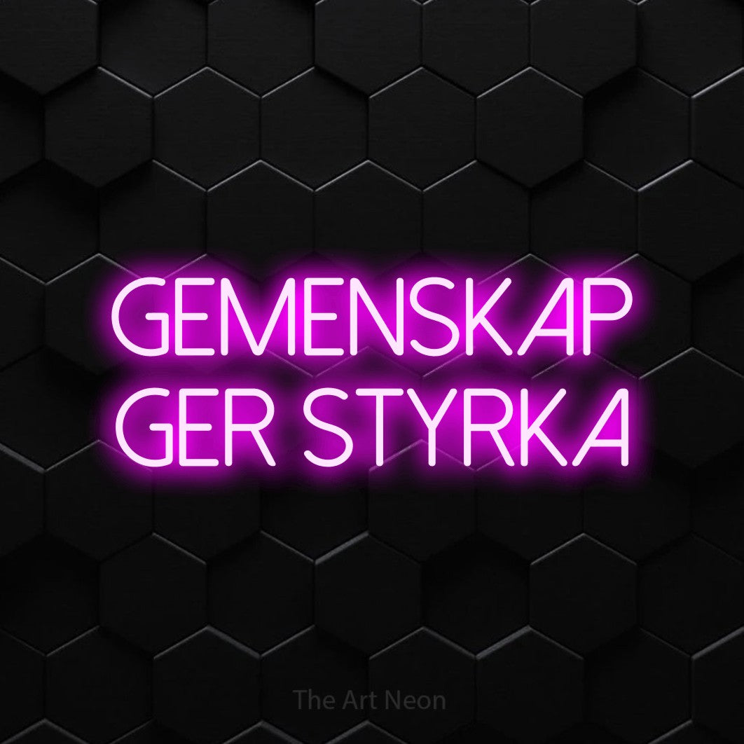 LED neon sign reading “gemenskap ger styrka”, arranged in 2 lines.