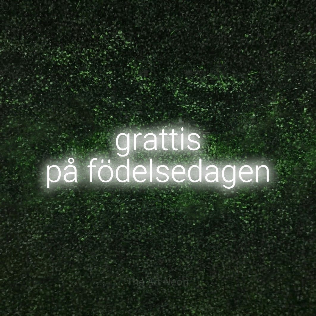 LED neon sign reading “grattis på födelsedagen”, arranged in 2 lines.
