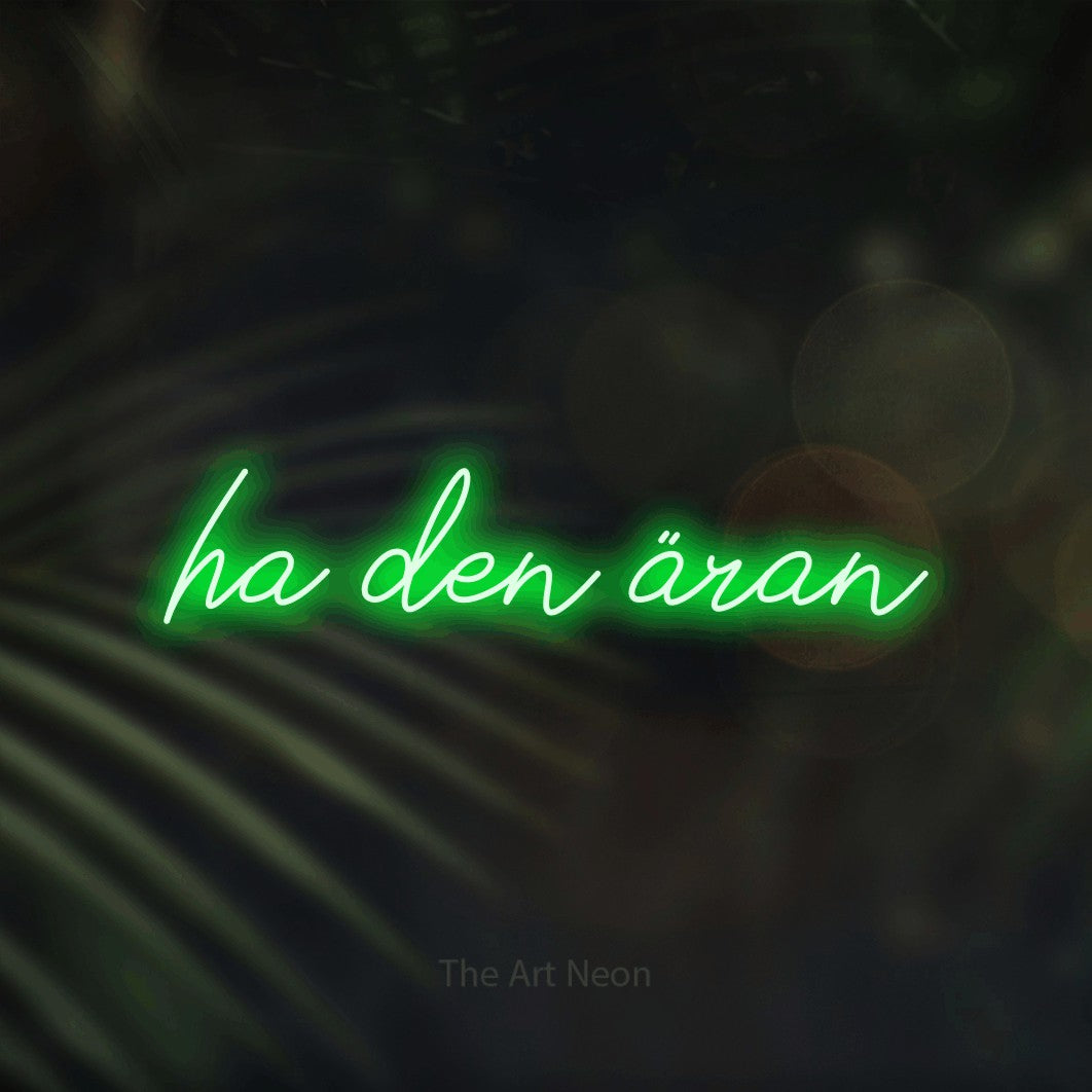 LED neon sign reading “ha den äran”, arranged in a single line.