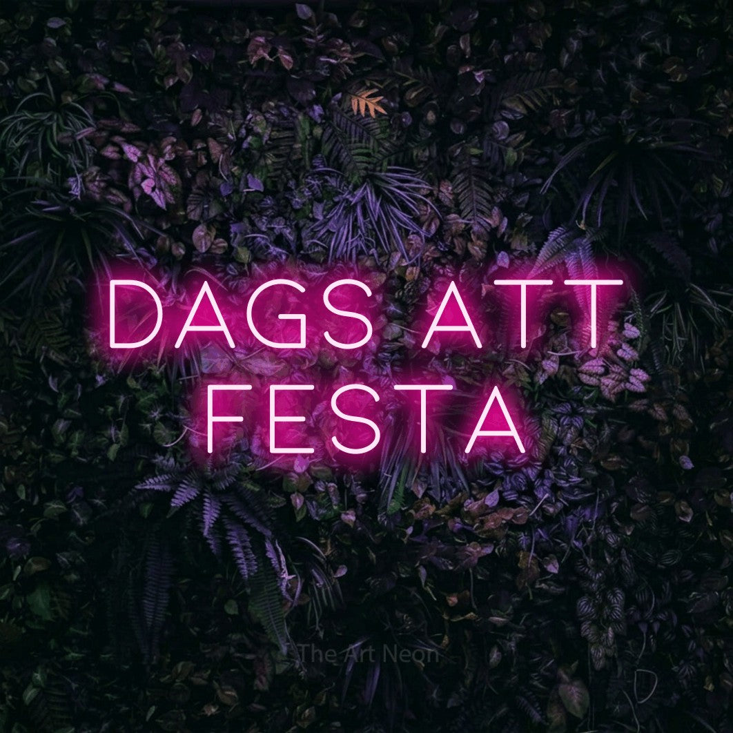 LED neon sign reading “DAGS ATT FESTA”, arranged in 2 lines.