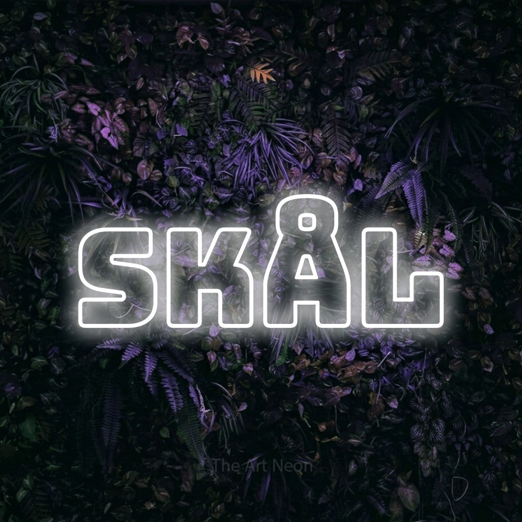 LED neon sign reading “skål”, arranged in a single line.
