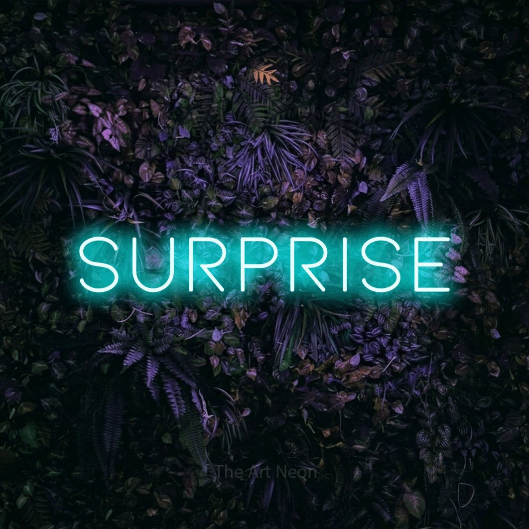 LED neon sign reading “surprise”, arranged in a single line.