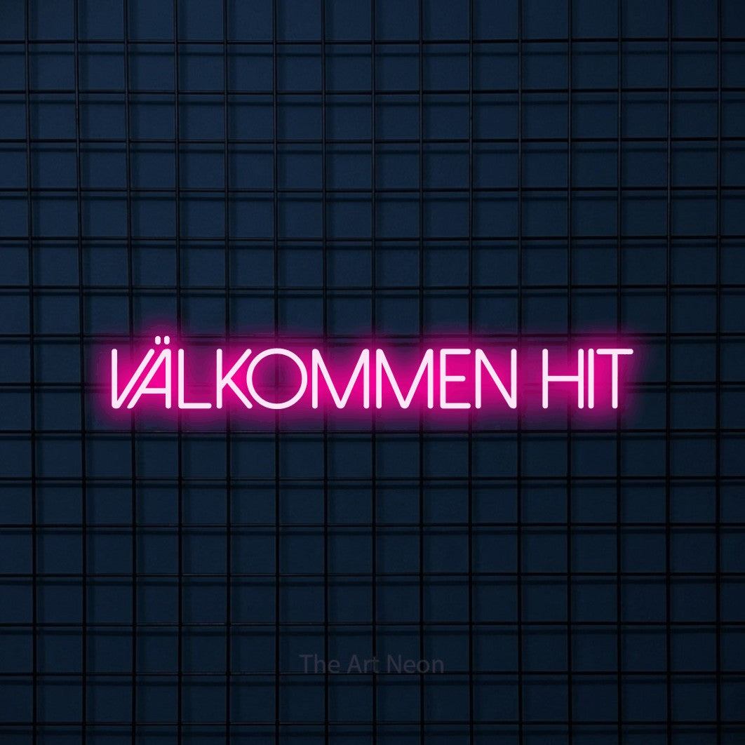 LED neon sign reading “Välkommen Hit”, arranged in a single line.