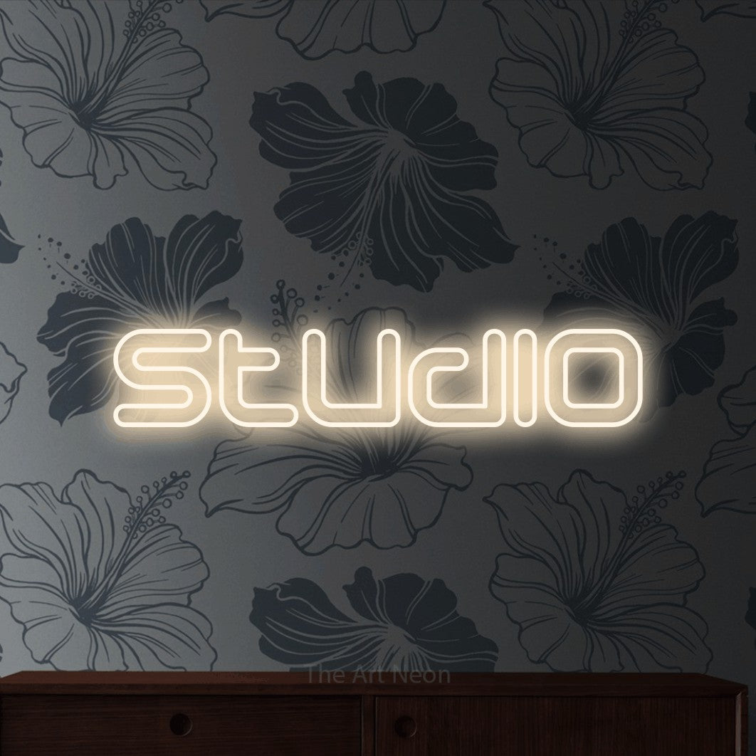 LED neon sign reading “Studio”, arranged in a single line.