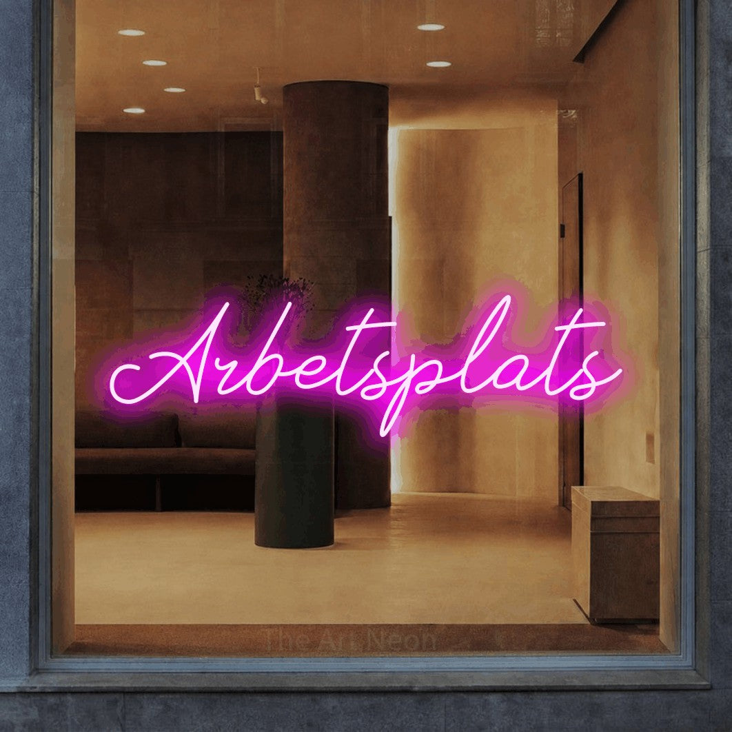 LED neon sign reading “Arbetsplats”, arranged in a single line.