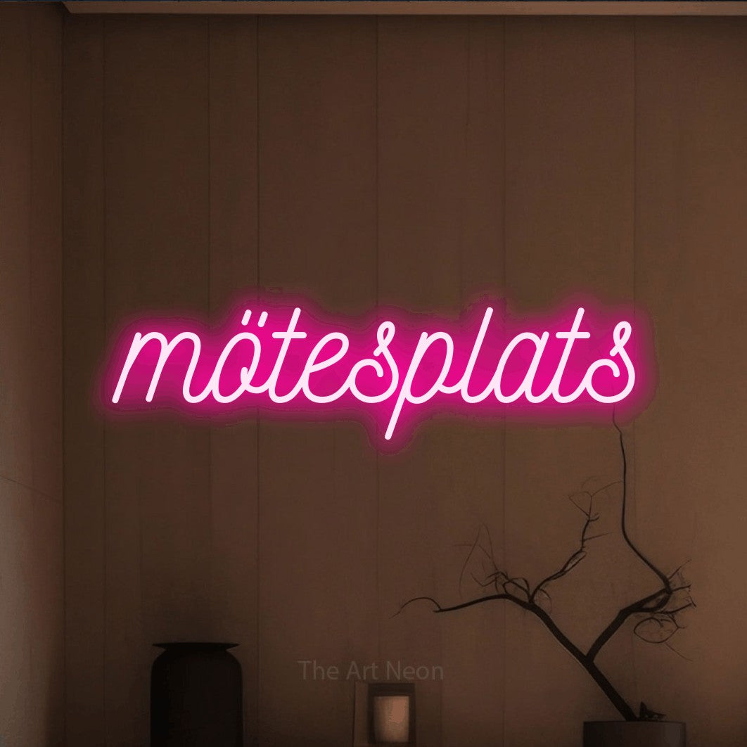 LED neon sign reading “mötesplats”, arranged in a single line.