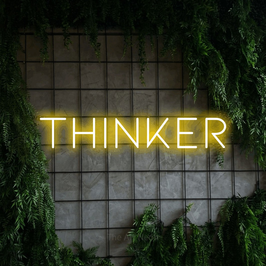 LED neon sign reading “THINKER”, arranged in a single line.