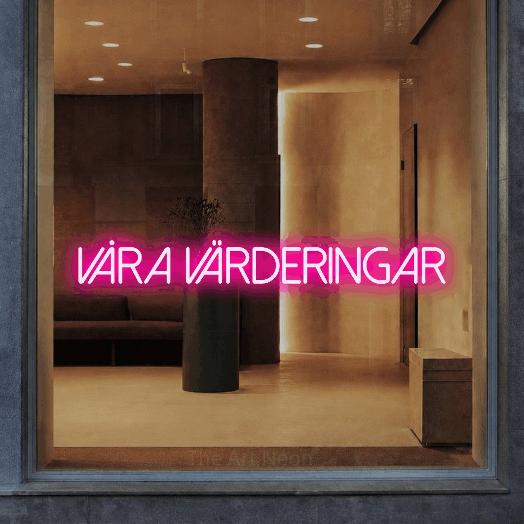 LED neon sign reading “VÅRA VÄRDERINGAR”, arranged in a single line.