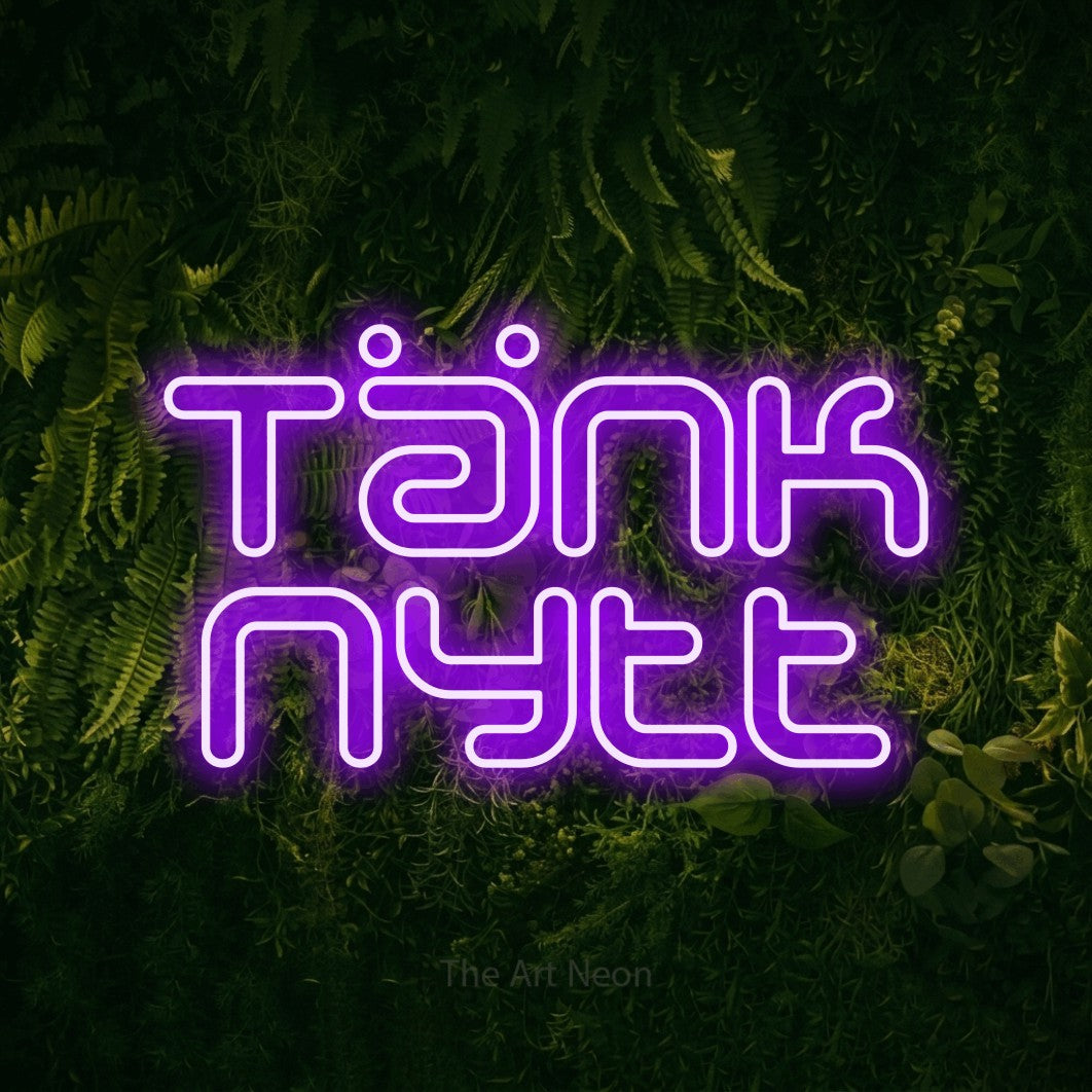LED neon sign reading “Tänk nytt”, arranged in 2 lines.