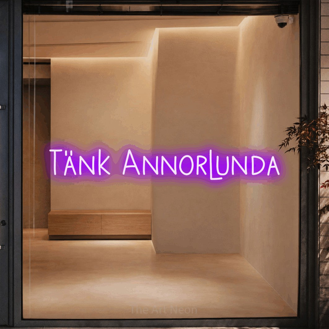 LED neon sign reading “Tänk Annorlunda”, arranged in a single line.